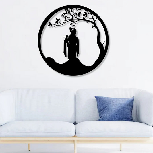 Decorative wall art with a silhouette of a person under a tree in a living room.