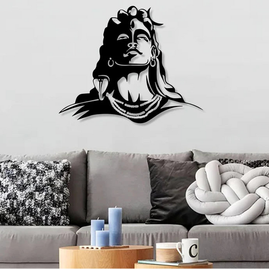 Wall decal of a stylized face with long hair and large fangs on a living room wall.